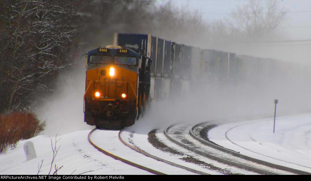 CSX 3142 leads a stack train through the curve at MP 381
